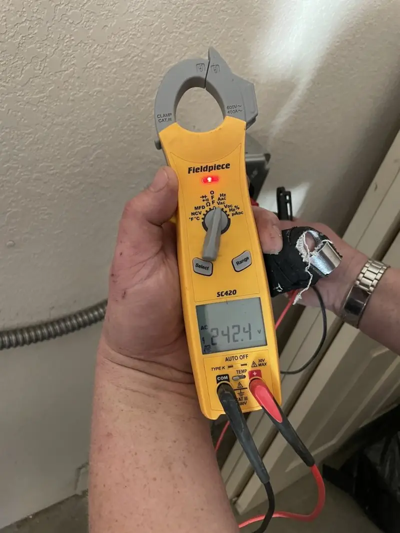 Voltage testing with clamp meter during Whole House Surge Protector in Fitchburg